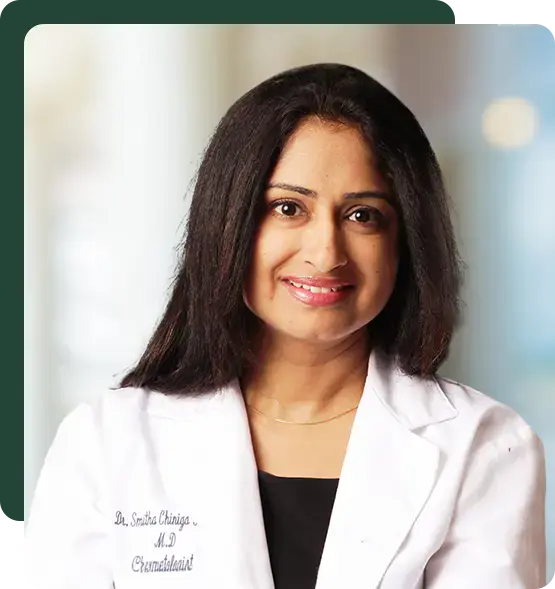 Dr. Smitha Reddy in a white coat